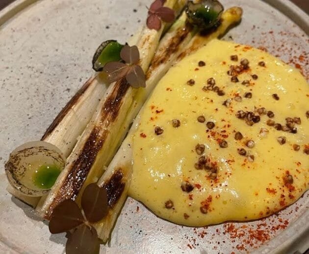 Charred Leeks with Creamy Polenta and Peppercorn Dust