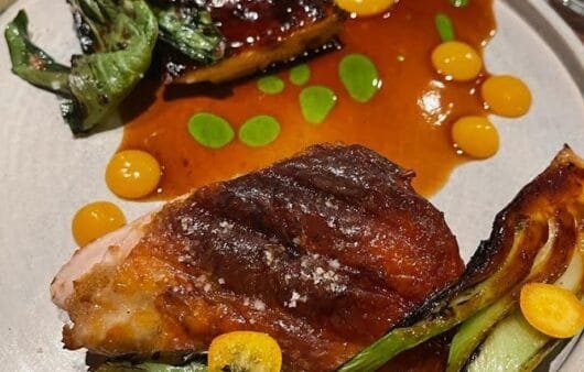 Crispy Chicken Thighs with Charred Bok Choy & Kumquat Reduction