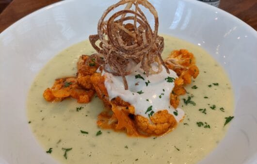 Buffalo Cauliflower with Creamy Celery Root Purée & Crispy Onions