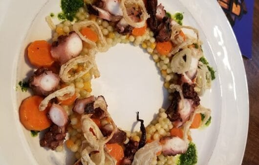 Grilled Octopus with Pearl Millet, Carrot Medallions & Herb Drizzle