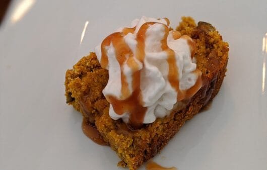 Gluten-Free Pumpkin Pecan Bar with Coconut Whipped Cream & Caramel Drizzle