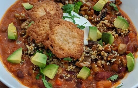 Hearty Vegan Chili with Avocado, Hemp Seeds & Crispy Chickpea Crackers