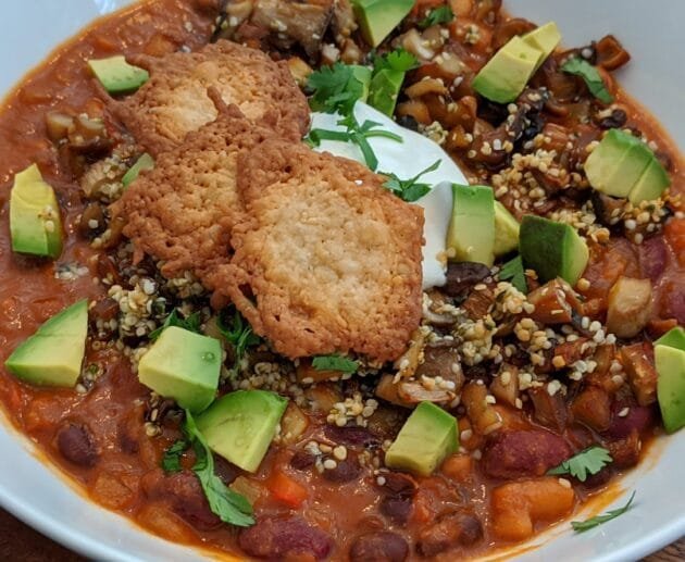 Hearty Vegan Chili with Avocado, Hemp Seeds & Crispy Chickpea Crackers