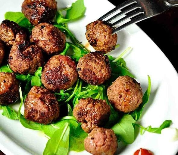 Juicy Herb-Infused Meatballs on Arugula