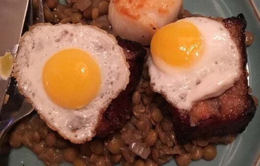 Seared Scallop & Pork Belly with Sunny Quail Eggs Over Garlic Lentils