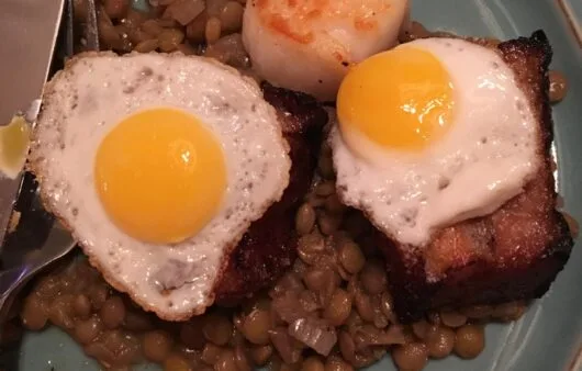 Seared Scallop & Pork Belly with Sunny Quail Eggs Over Garlic Lentils