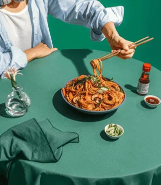 Gluten-free dairy-free noodle dish with vegetables and chopsticks, healthy dinner recipe.